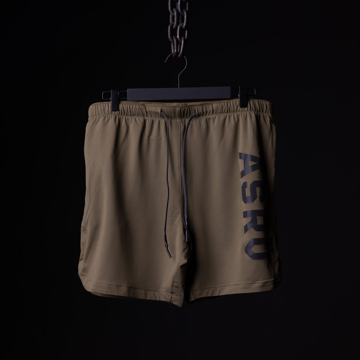 SP'19 7" Linerless Short in khaki tan, front view hanging on hanger