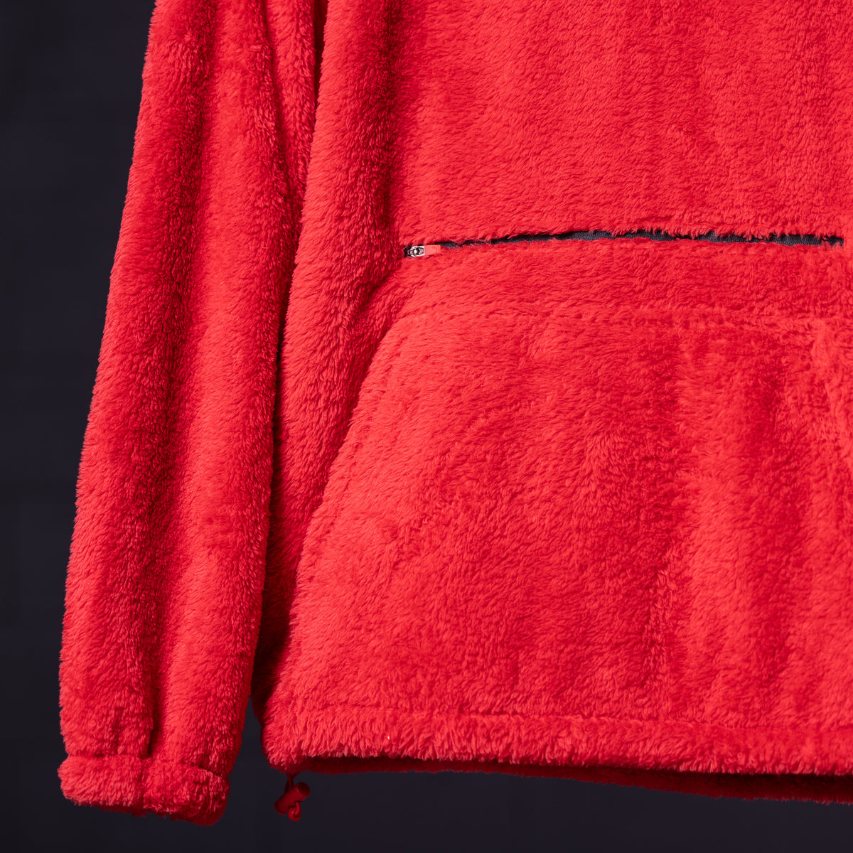 WN '23 Sherpa Recovery Hoodie in red, detail shot of fabric texture and zipper
