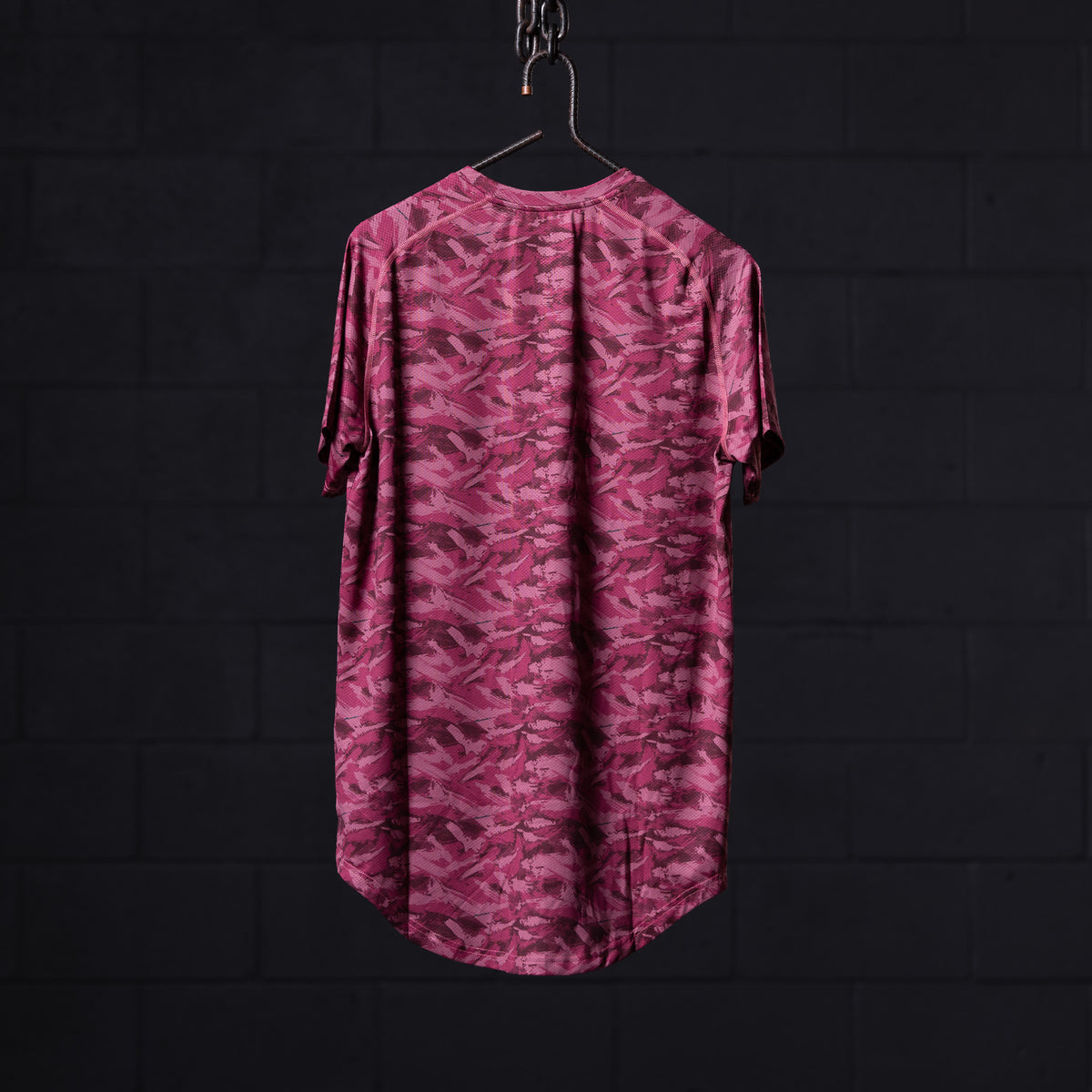 SM'20 Established Tee in pink camo, back view on hanger against dark background