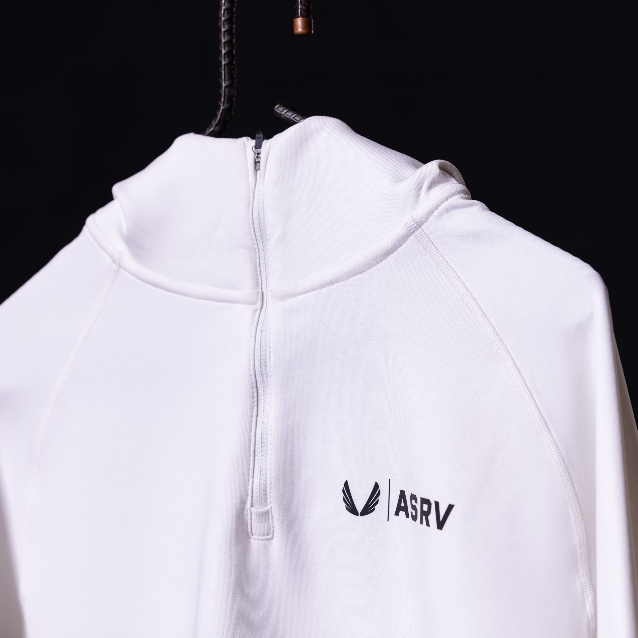 White ASRV Scuba Hoodie on hanger, back view showing quarter-zip and logo
