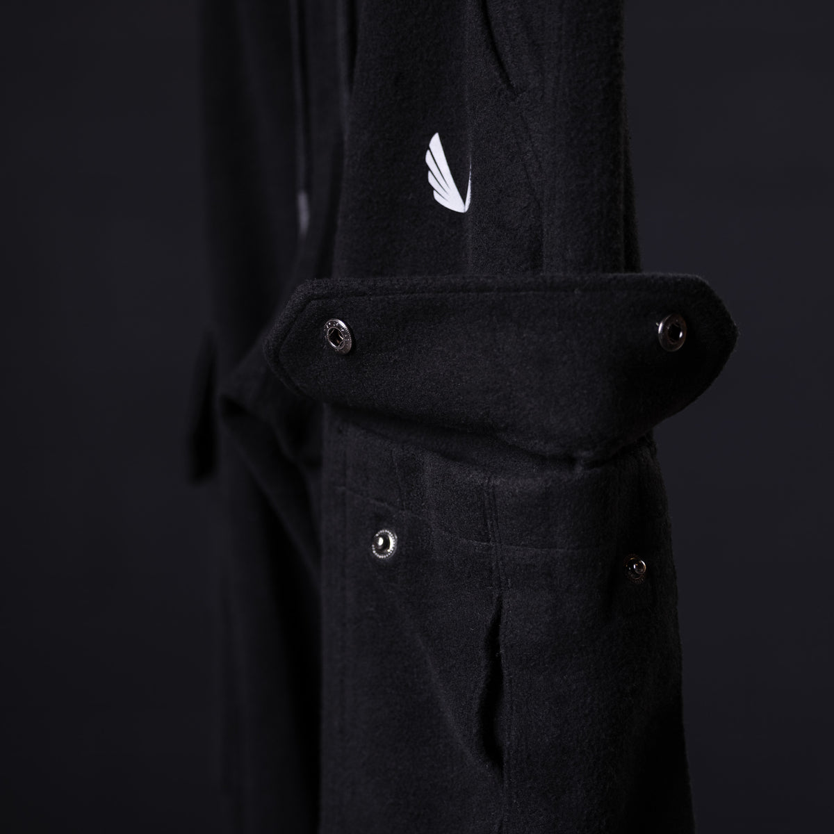 Black reverse weave jogger worn on model, showing side pocket and ASRV logo detail