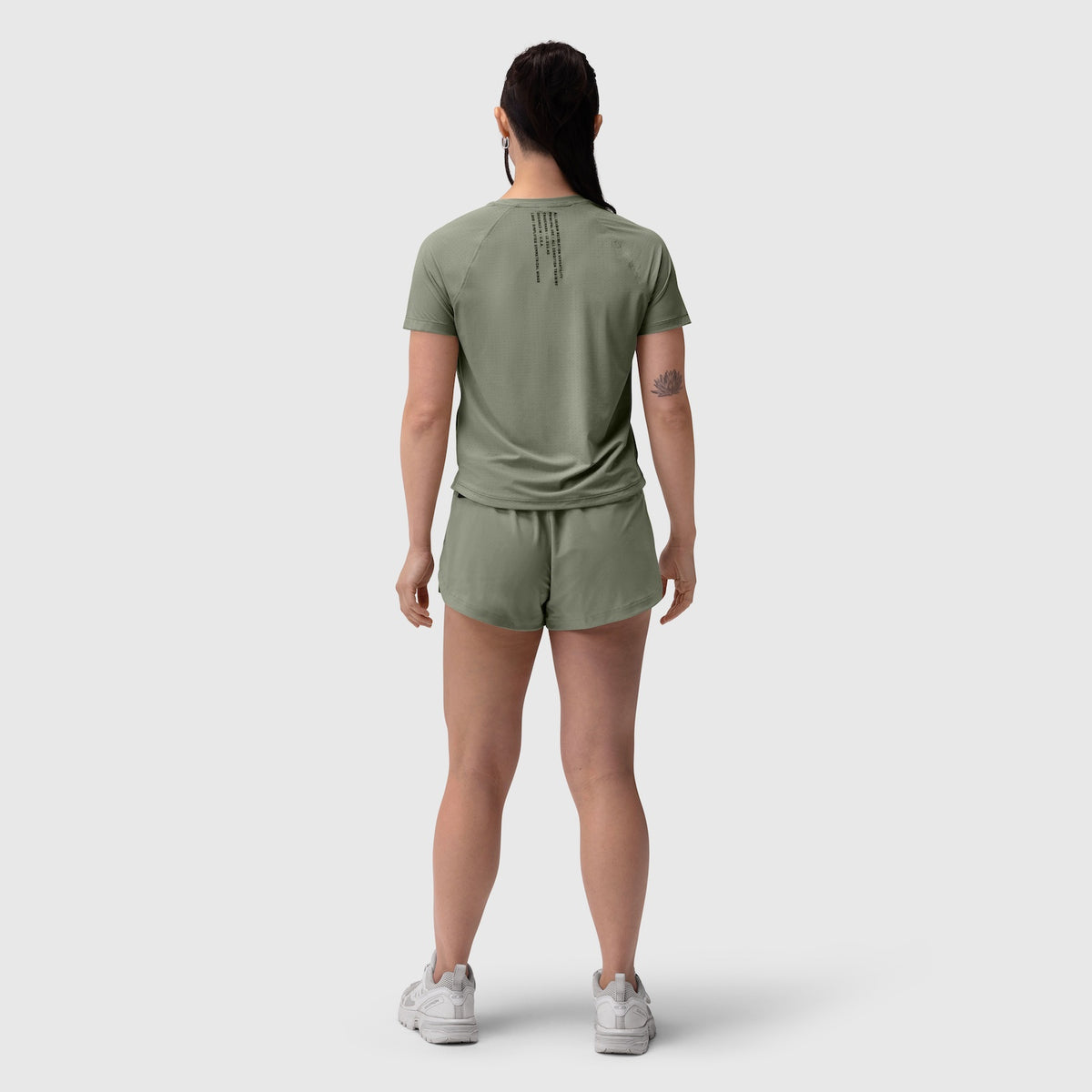 W017 Laser-Vent Established Tee in sage worn with matching shorts, back view