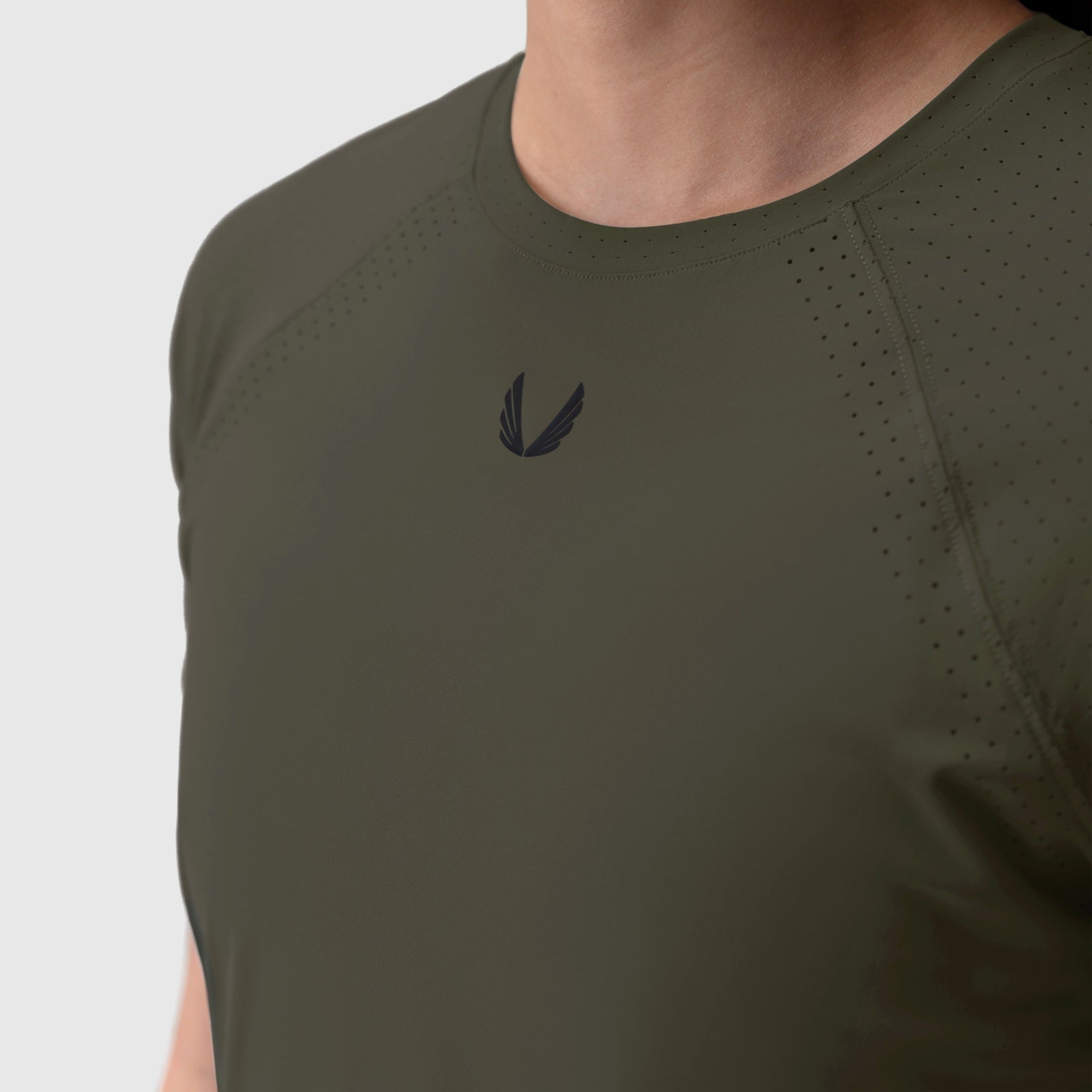 Laser-Vent Established Tee in olive worn by model, front view showing logo detail