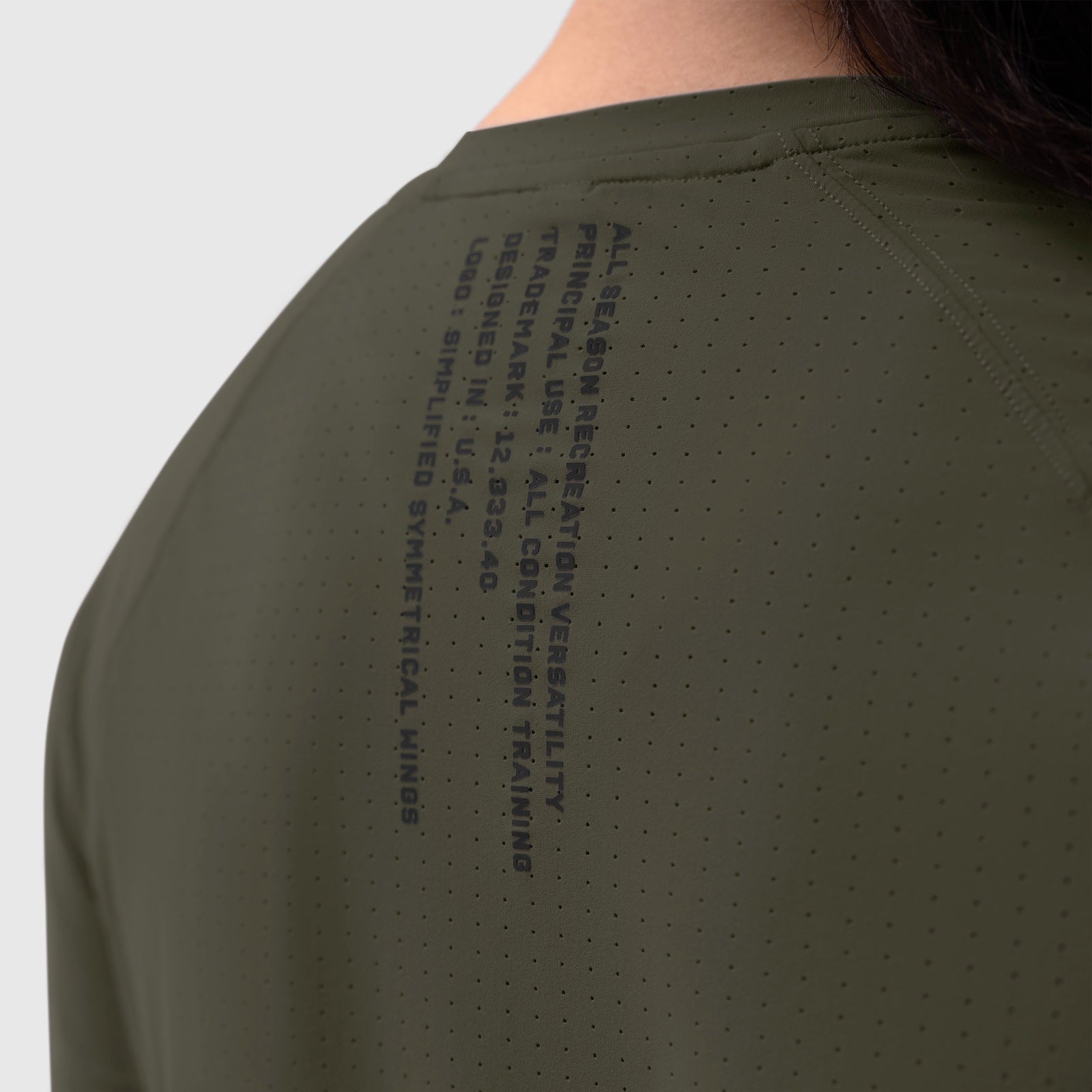 Laser-Vent Established Tee in olive worn by model, back view showing perforated fabric detail
