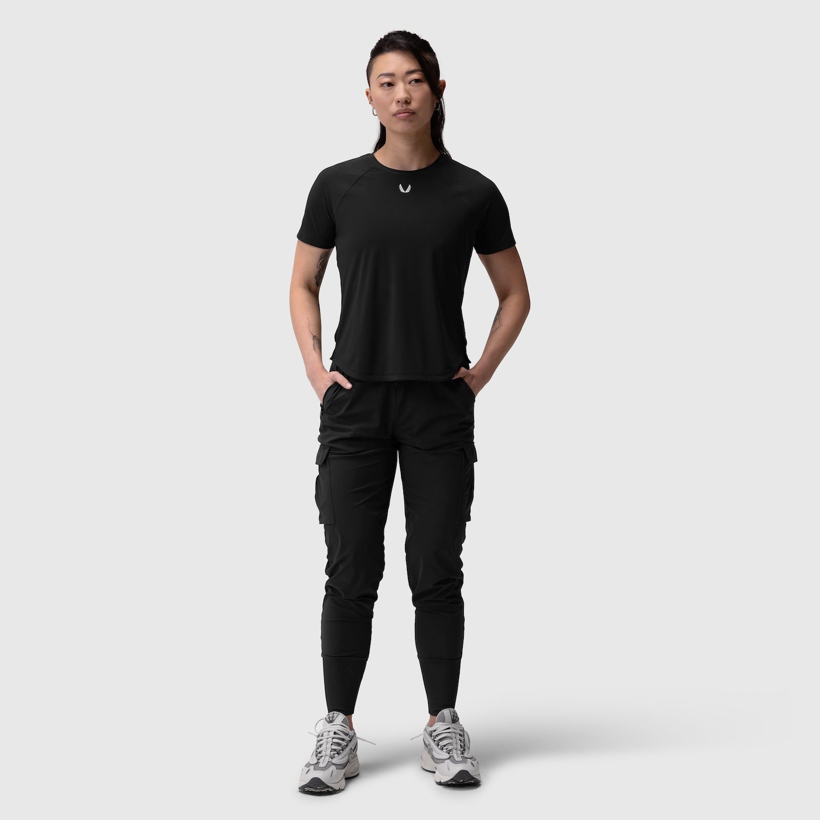 Black Laser-Vent Established Tee worn with black cargo pants and white sneakers, front view