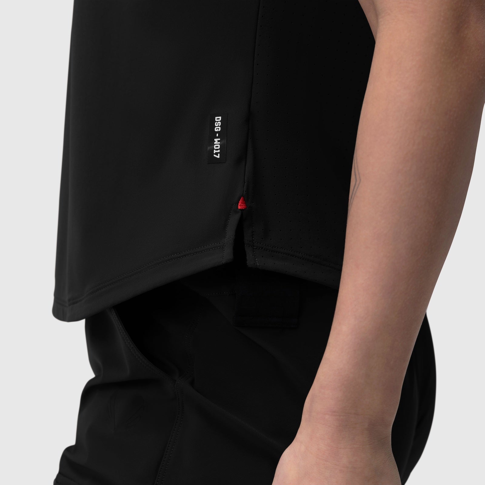 Black Laser-Vent Established Tee worn by model, side view showing fabric and branding detail