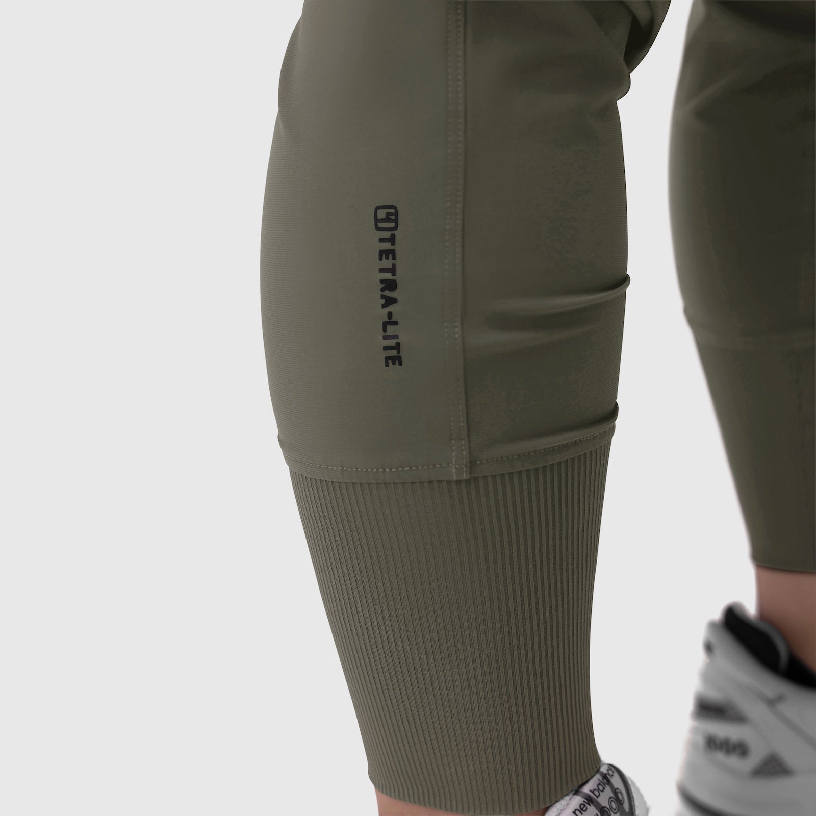 Tetra-Lite Cargo High Rib Jogger in olive worn by model, side view detail