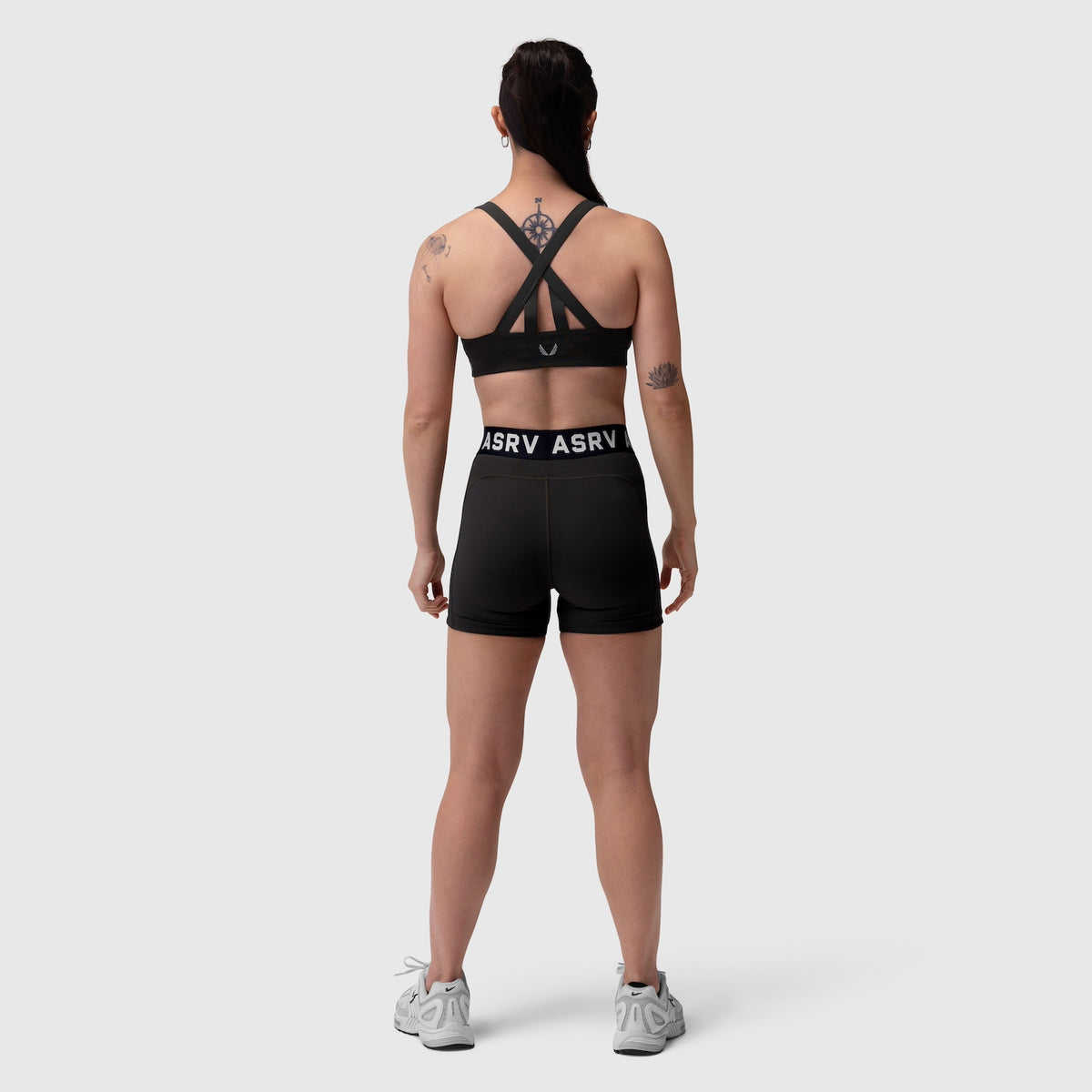Black Lycra Hybrid Sports Bra with cross-back straps, worn by model from back view