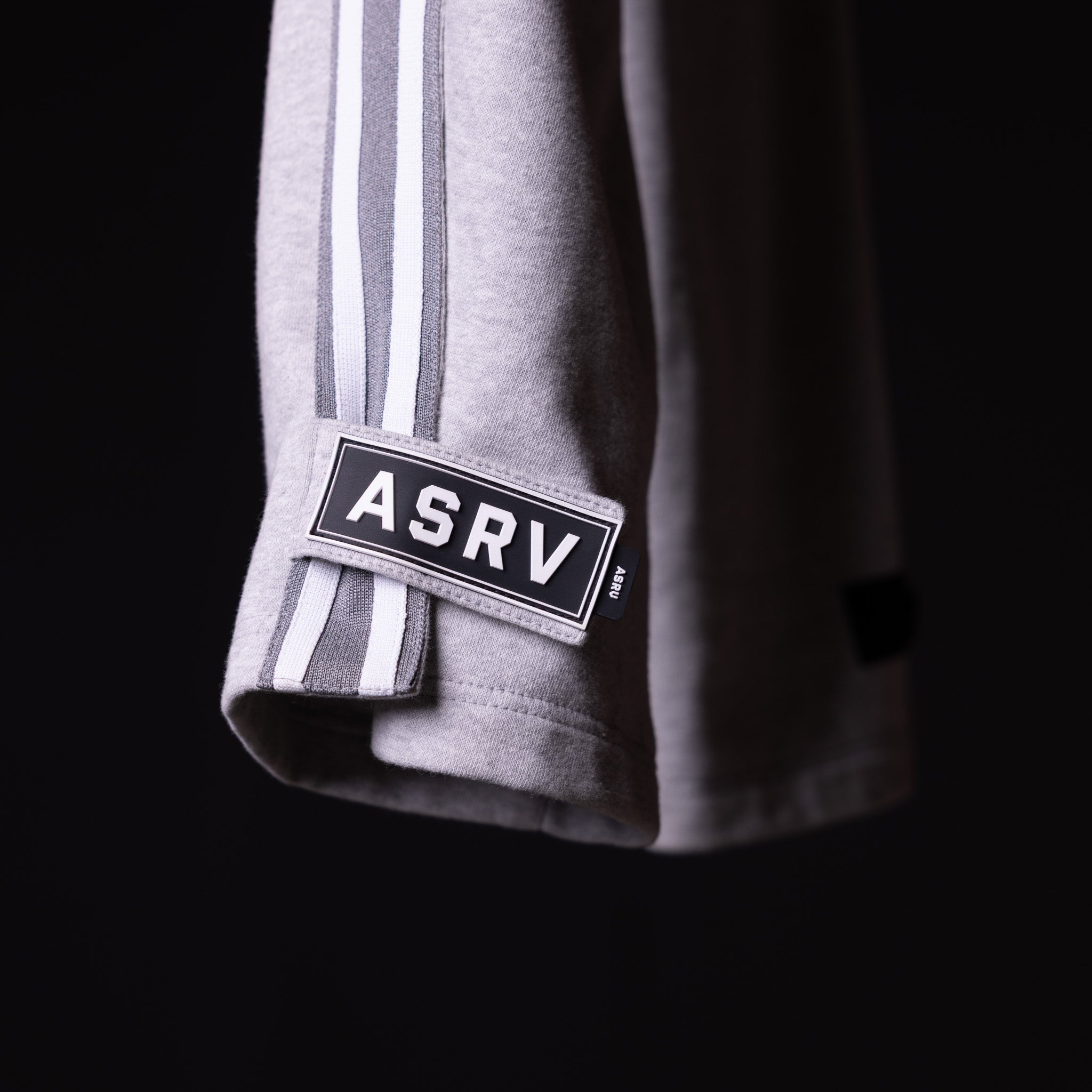 SP'22 Tearaway Jogger in grey with ASRV label detail on sleeve