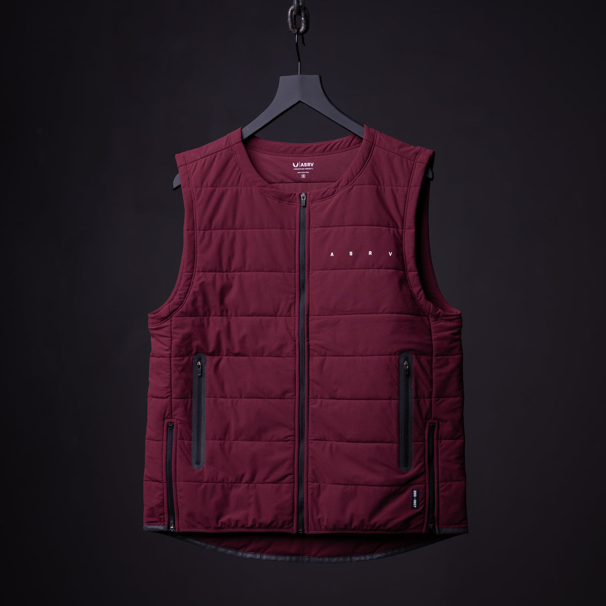FA'22 Adventure Vest in burgundy, front view on hanger