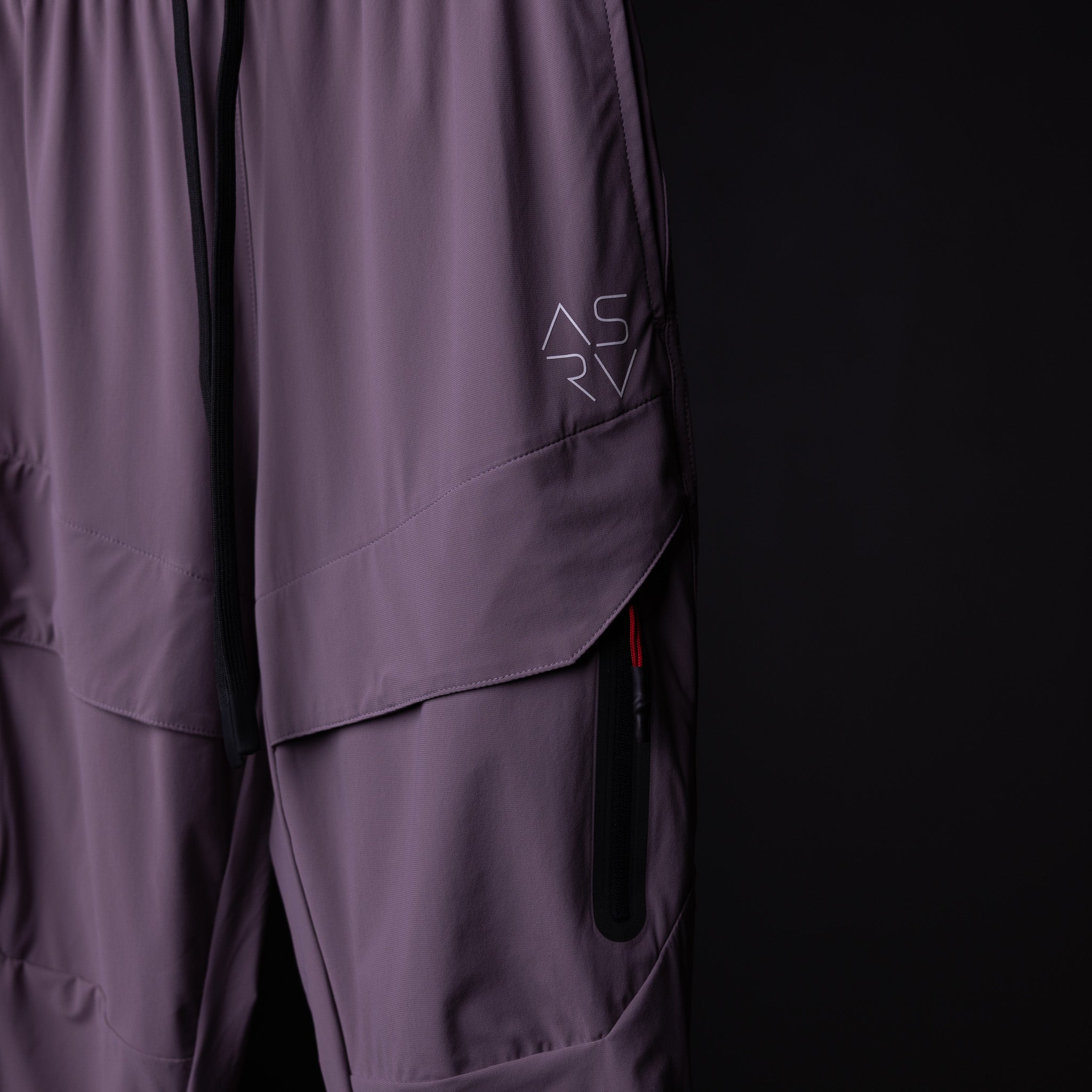 WN'23 Cyber Tech High Rib Jogger in purple, detail shot of side pocket and seaming