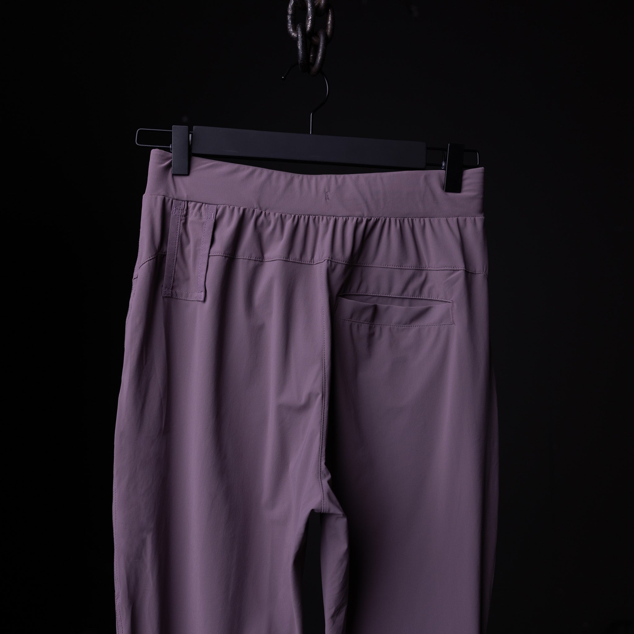 Flatlay of WN'23 Cyber Tech High Rib Jogger in purple, back view