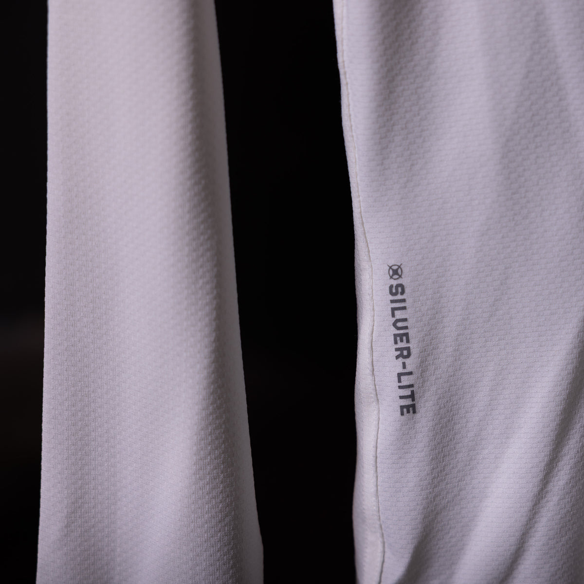 SP'20 Long Sleeve Shirt in lavender and black, detail shot showing Silver-Lite branding on sleeve