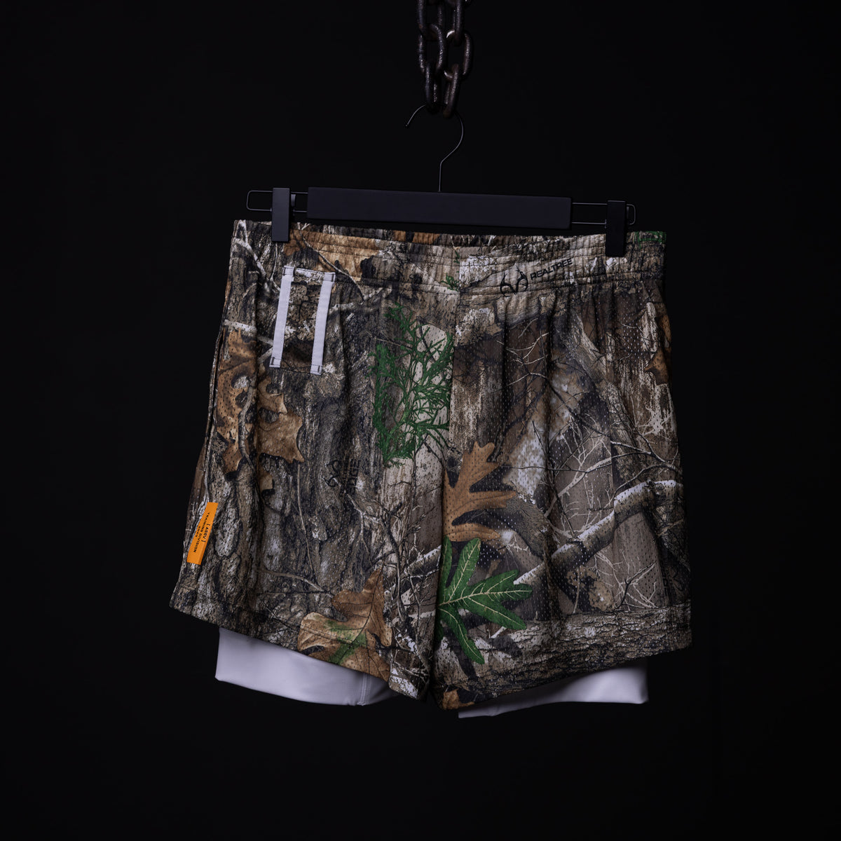 Training Division Mesh Shorts in camo with white underlay, front view, on hanger