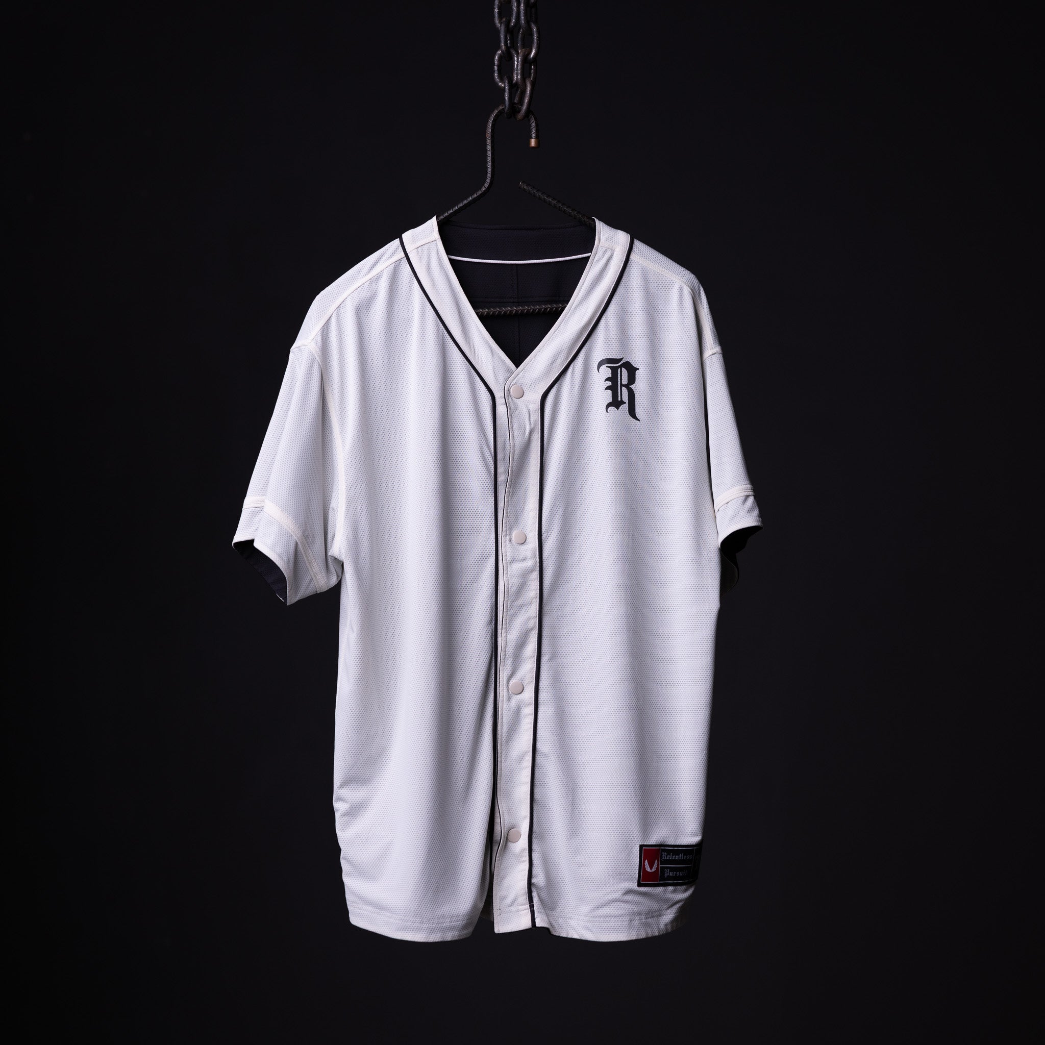 FA'21 Reversible Jersey in white, displayed on hanger against black background