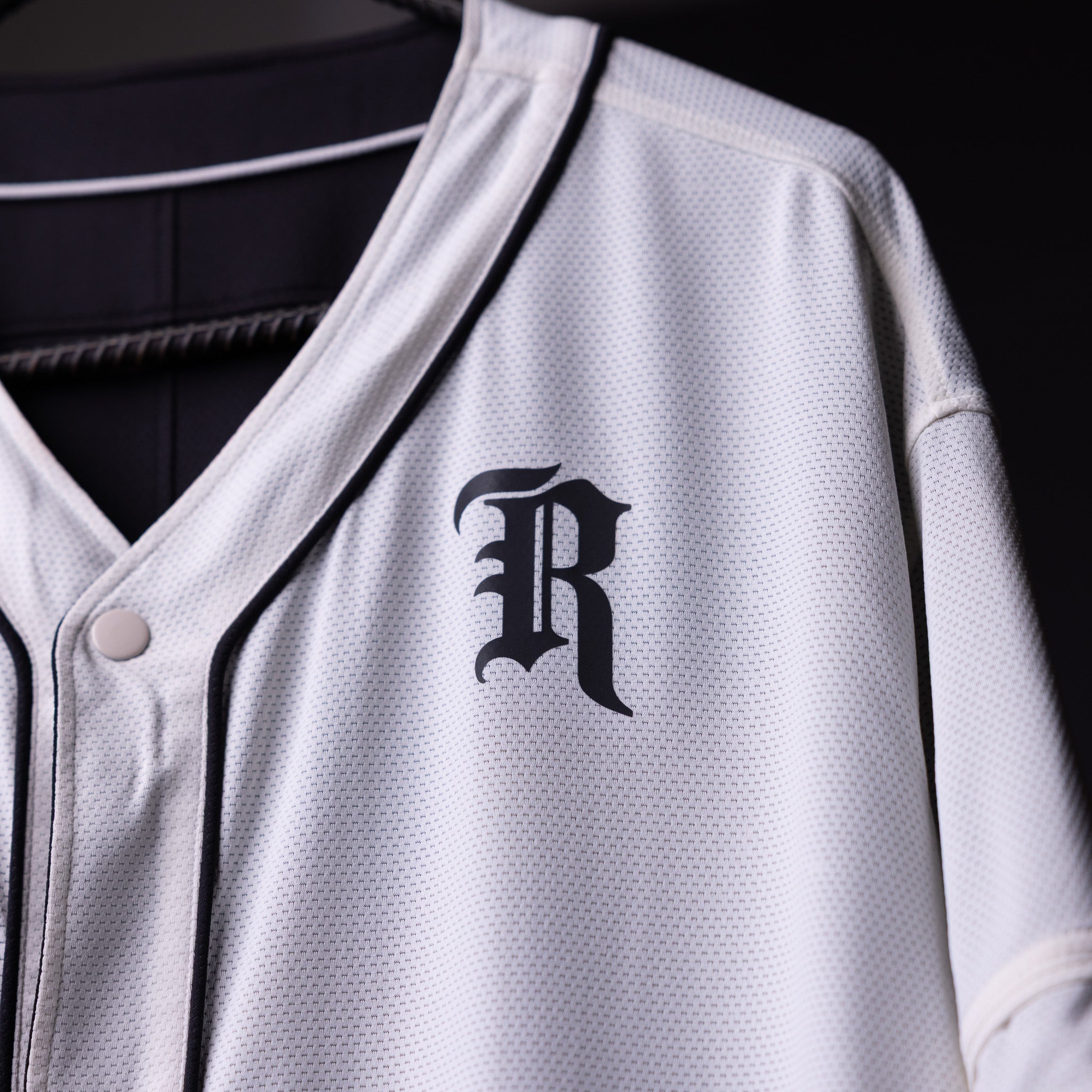 FA'21 Reversible Jersey in white with 'R' logo, displayed on hanger