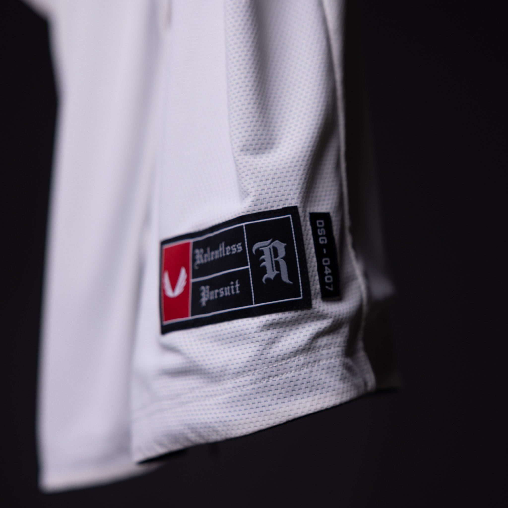 FA'21 Reversible Jersey label closeup detail shot showing Relentless Pursuit branding on white fabric