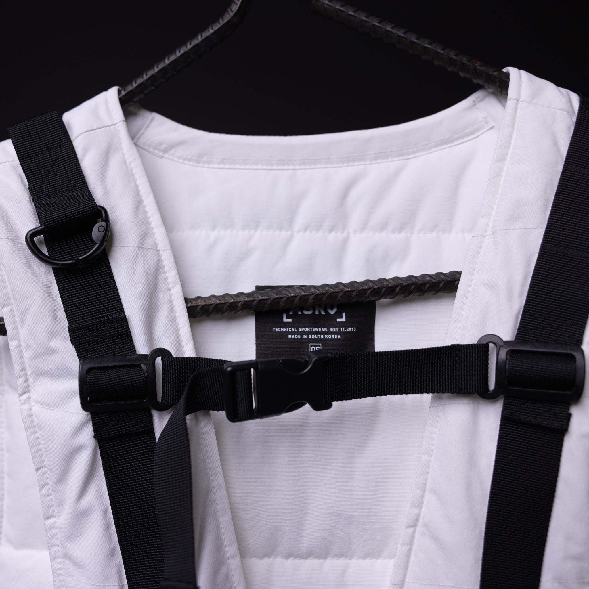 2018 Technical Vest in white with black straps, displayed on hanger with detail view