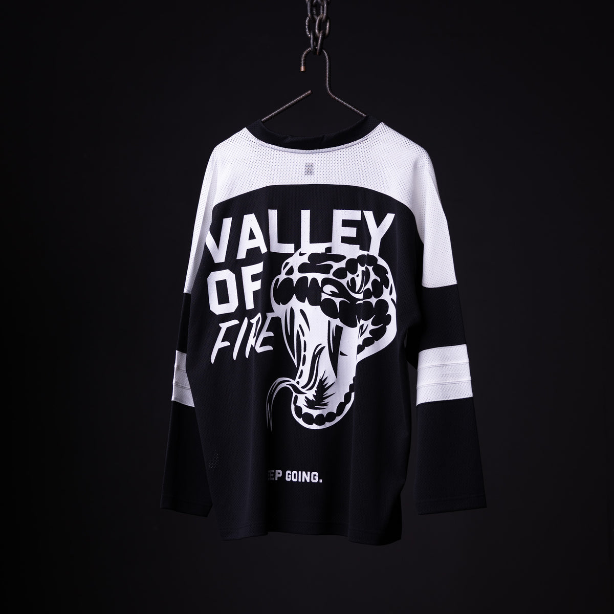 SM'23 long-sleeve jersey in black and white, hanging on hanger with 'Valley of Fine' graphic