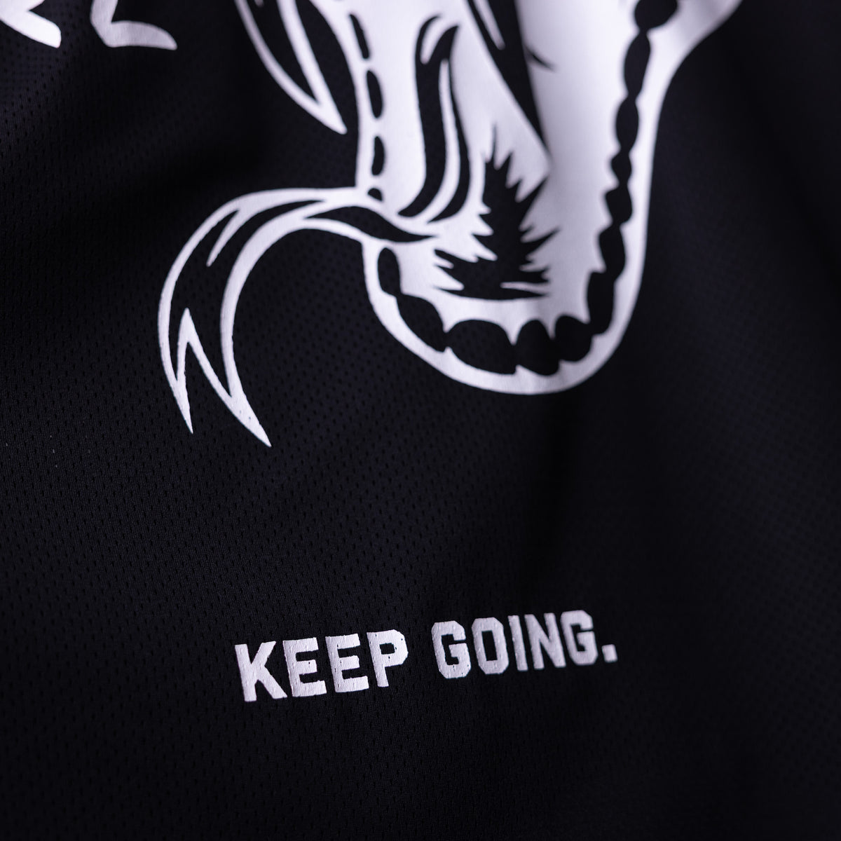 SM'23 Mesh Long-sleeve Jersey in black with white graphic design and 'Keep Going' text, detail closeup