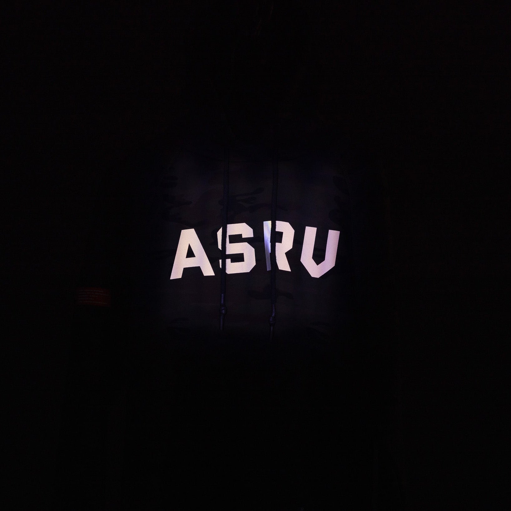 WN'19 RainPlus® Hoodie in black, front view with illuminated brand logo