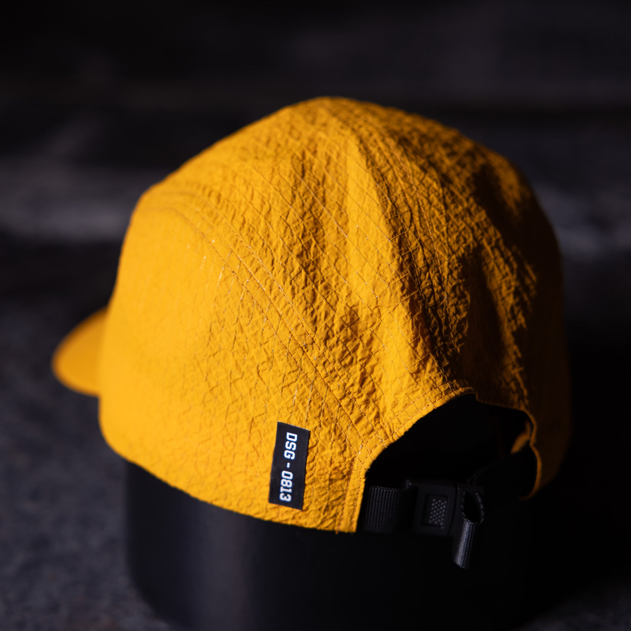 WN'23 5 Panel Hat in yellow, displayed on mannequin head showing front profile view