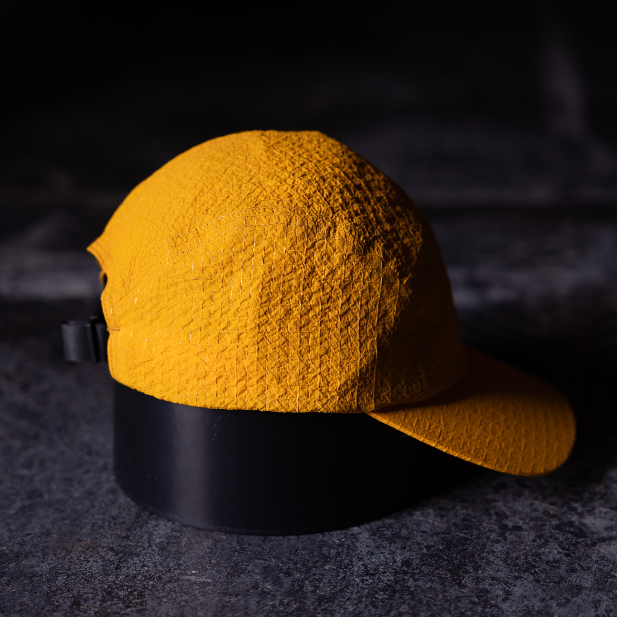 WN'23 5 Panel Hat in gold yellow with black band, top view