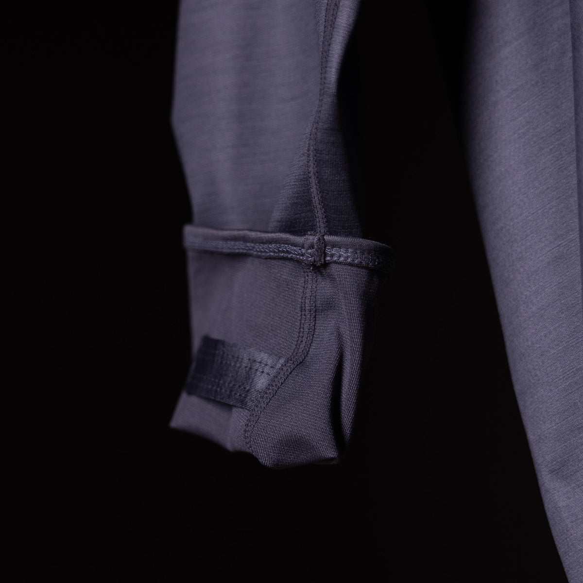 SM'18 Quarter Zip Hoodie in charcoal gray, sleeve detail closeup showing zipper and cuff