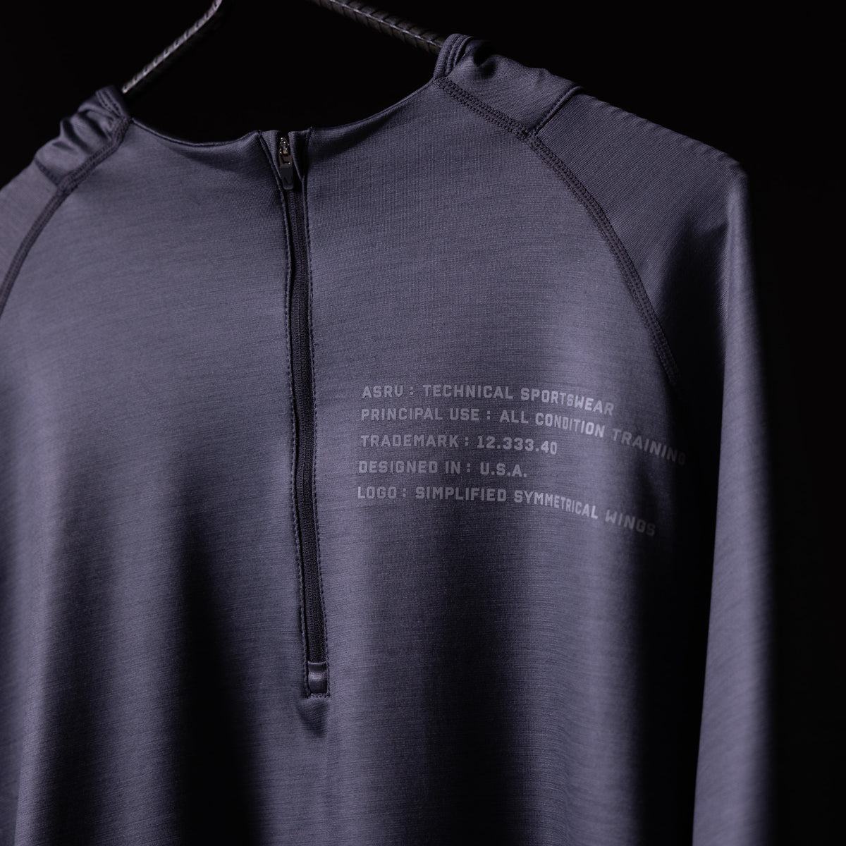 SM'18 Quarter Zip Hoodie in purple, displayed on hanger showing front with text details