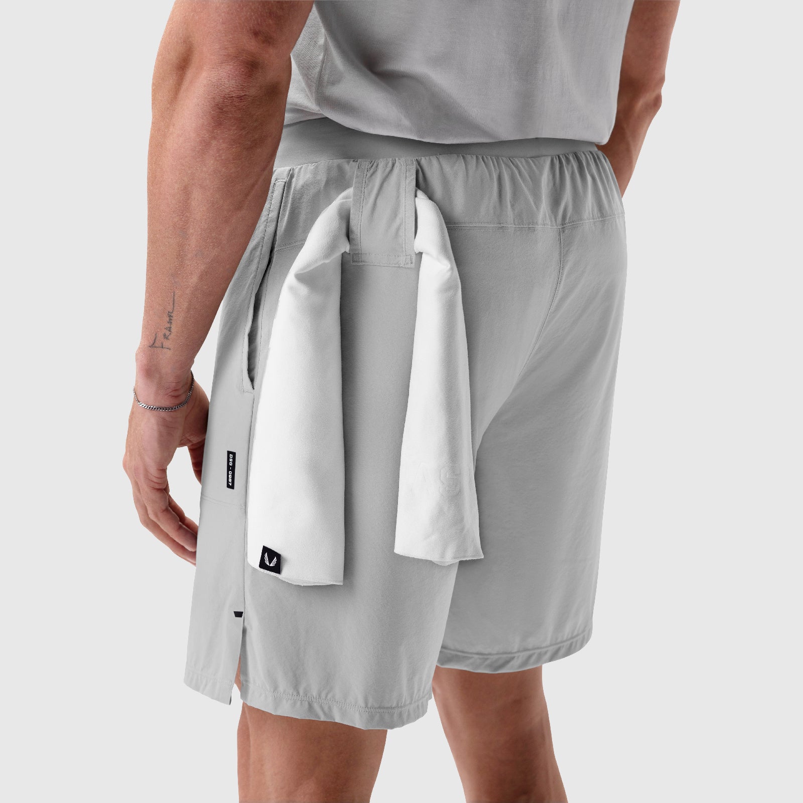 Aerotex Training Short in Slate Grey worn by model, back view with towel detail