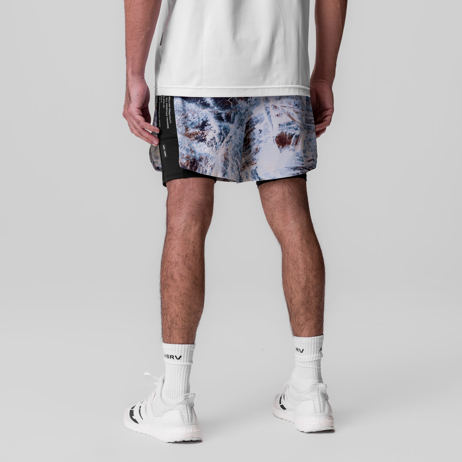 Aerotex Hybrid Liner Short in blue Realtree Aspect camo, worn by model, back view