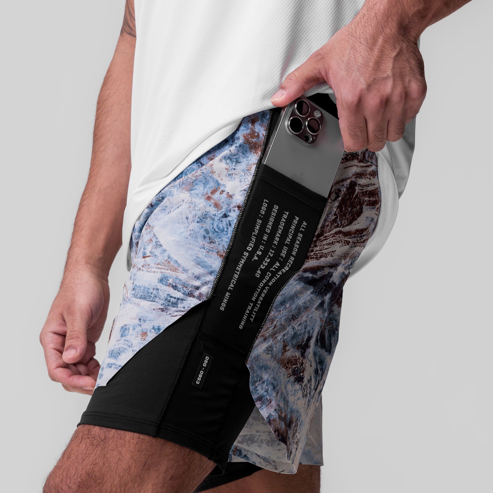 Aerotex Hybrid Liner Short in Realtree Aspect camo, worn with phone in pocket