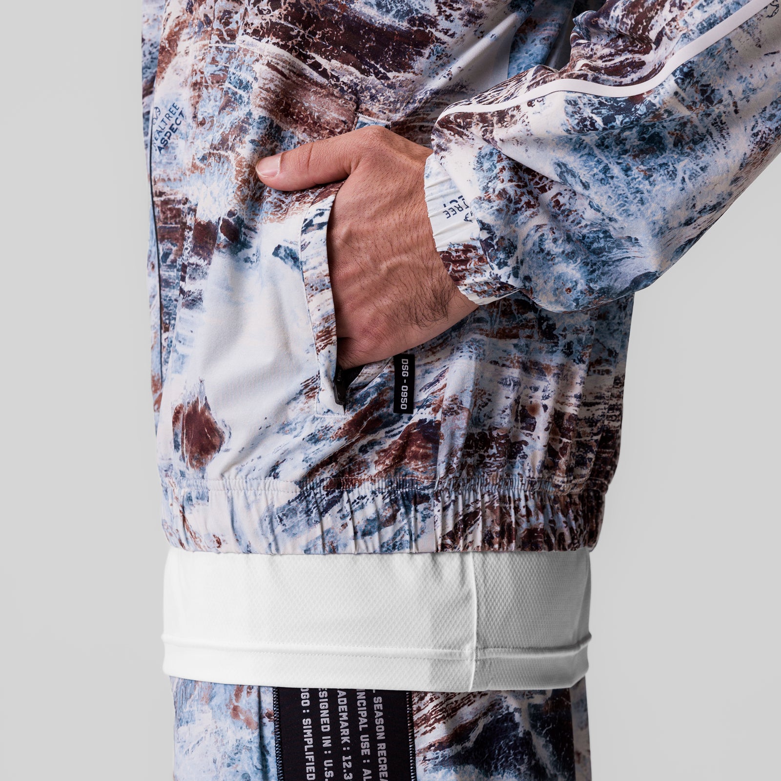 Aerotex Track Jacket in Realtree Aspect camo pattern, model wearing with hand in pocket