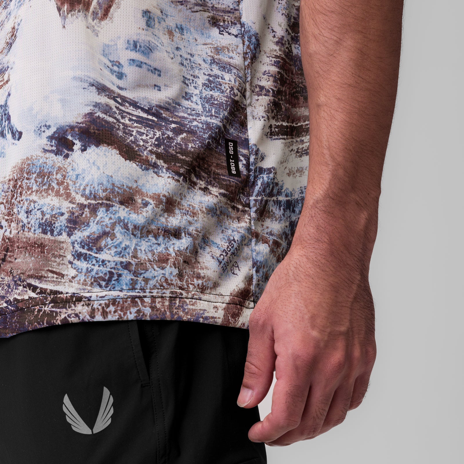 Ice-Skin Oversized Tee in brown/blue Realtree camo, worn by model showing side view