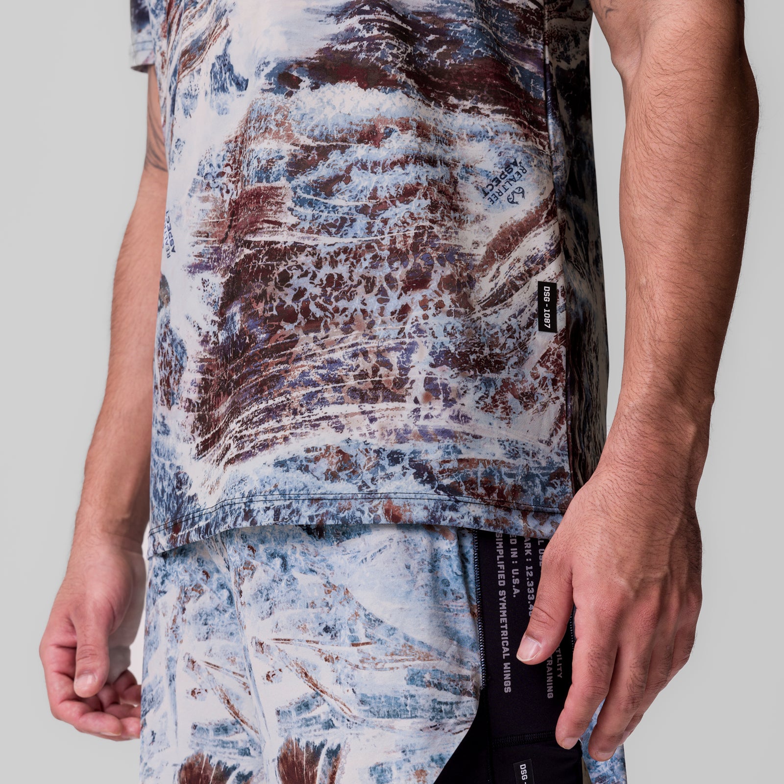 Tetra-Lite Ice Zip Tee in blue and brown camo print, worn by model, side view