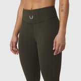 W002 LYCRA® ADAPTIV Legging in olive, worn by model, front waist detail view