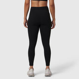 Black LYCRA® ADAPTIV legging on model, back view, paired with white sneakers