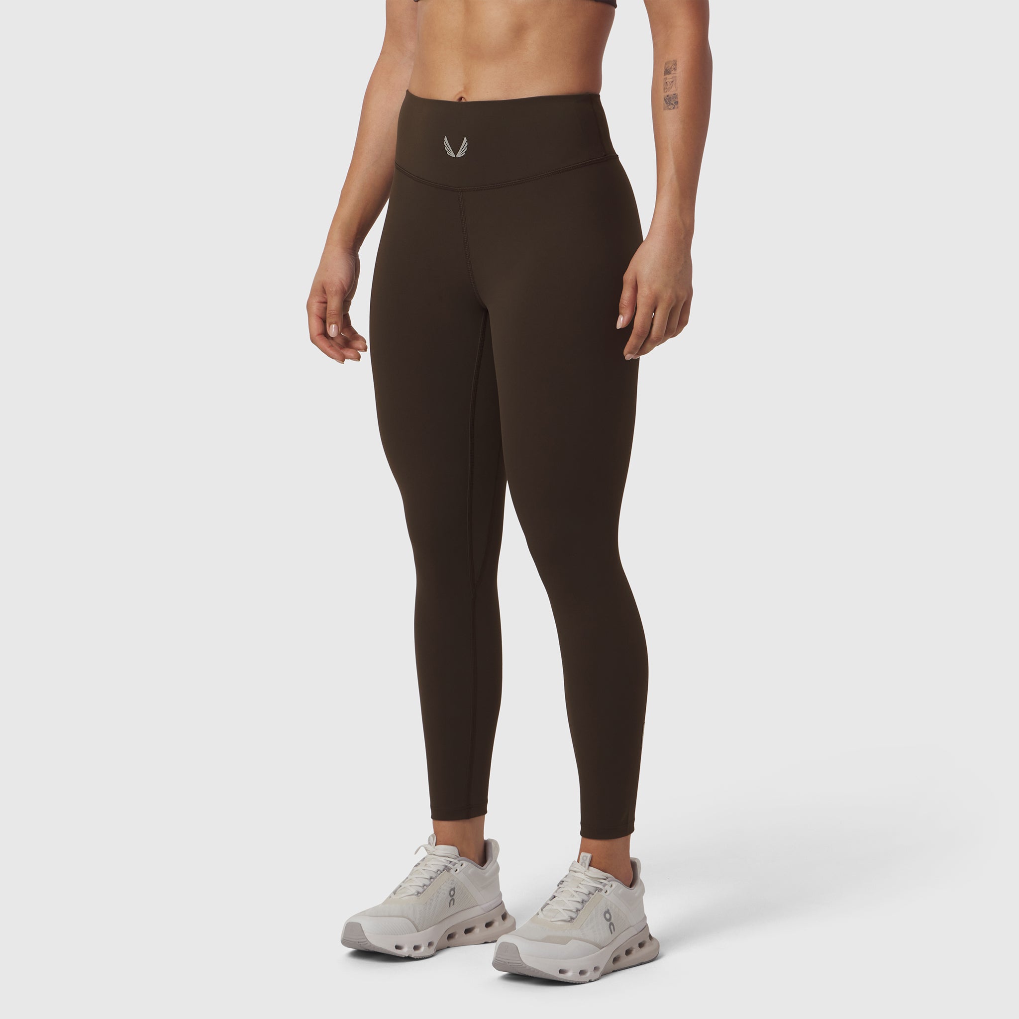 W002 LYCRA® ADAPTIV legging in dark earth, worn by model, front view