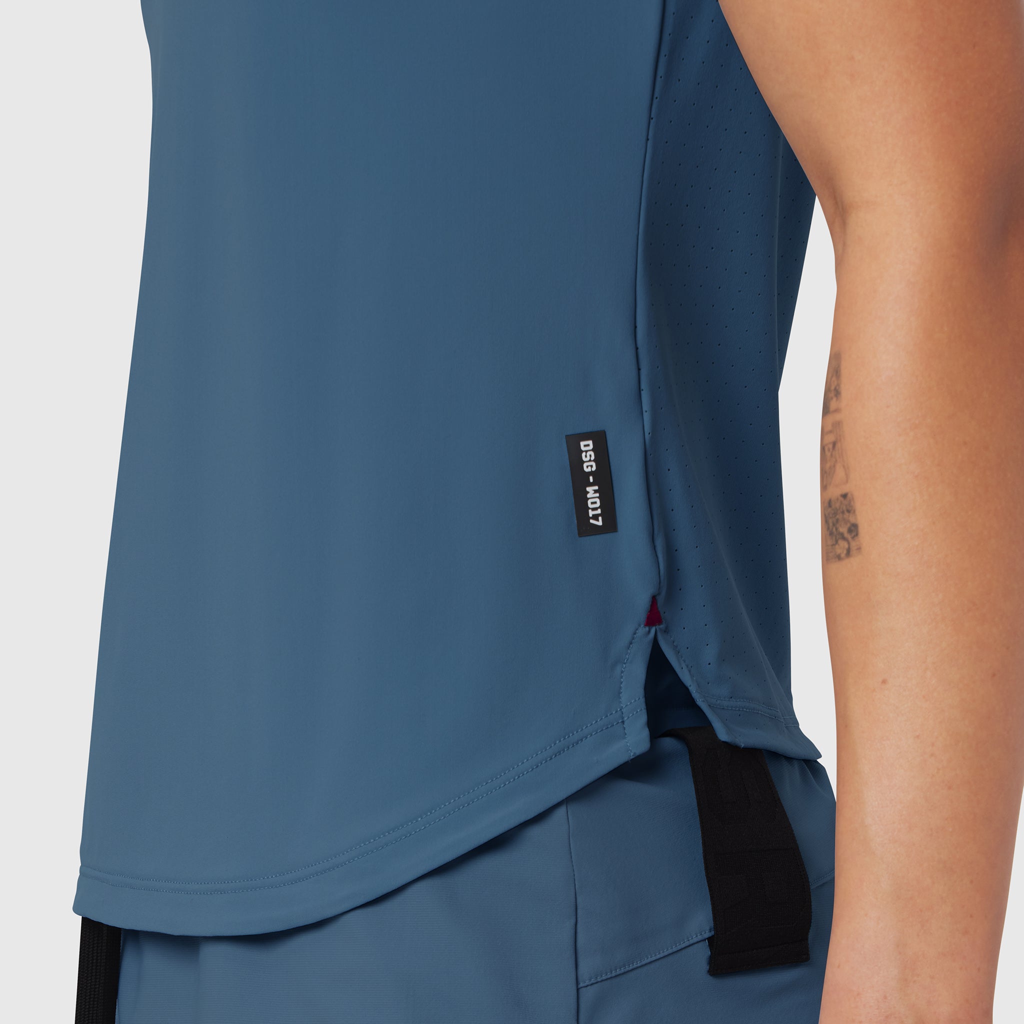 Laser-Vent Established Tee in storm blue, worn by model showing side view and fit