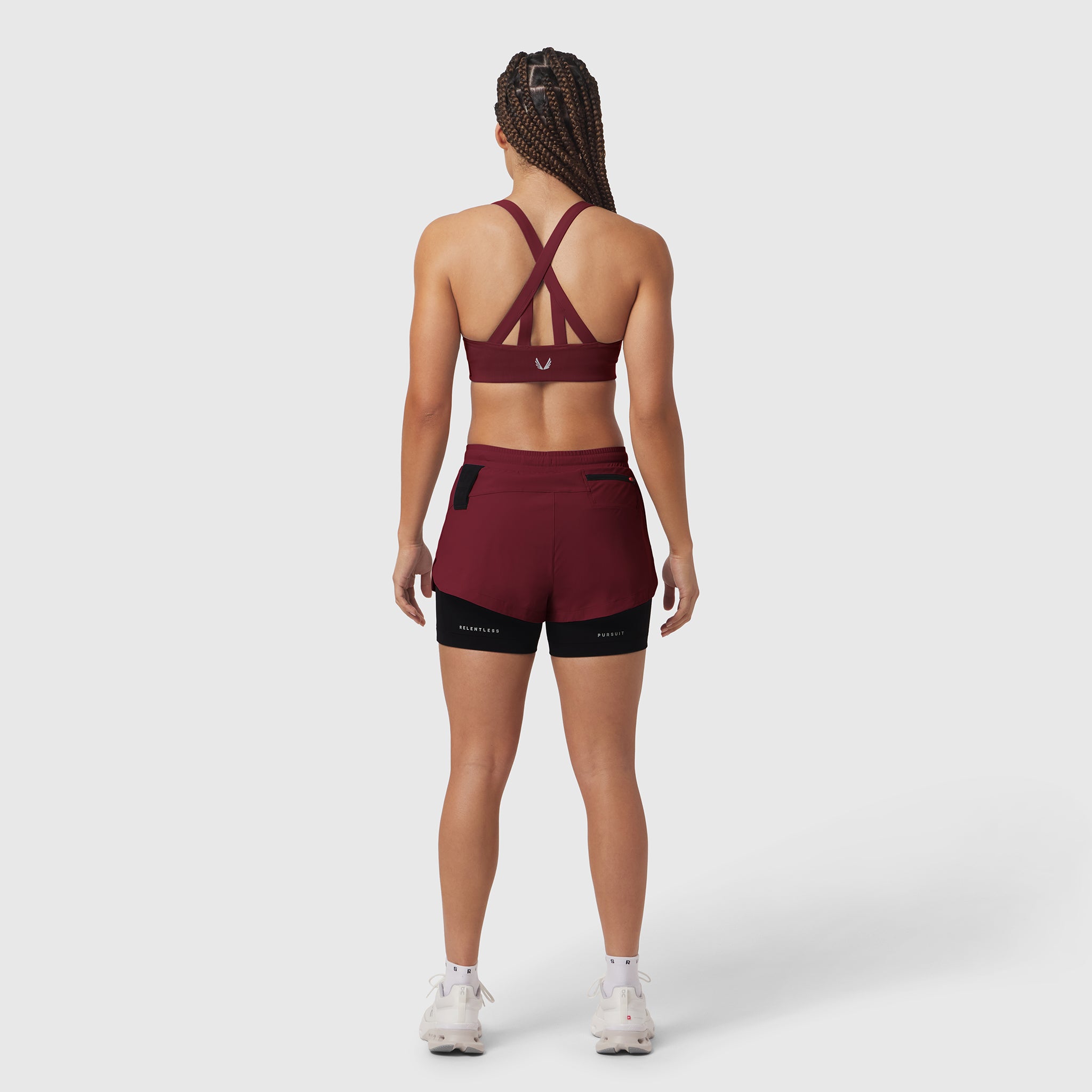 W025 Tetra-Lite Liner Short in crimson and black, back view on model