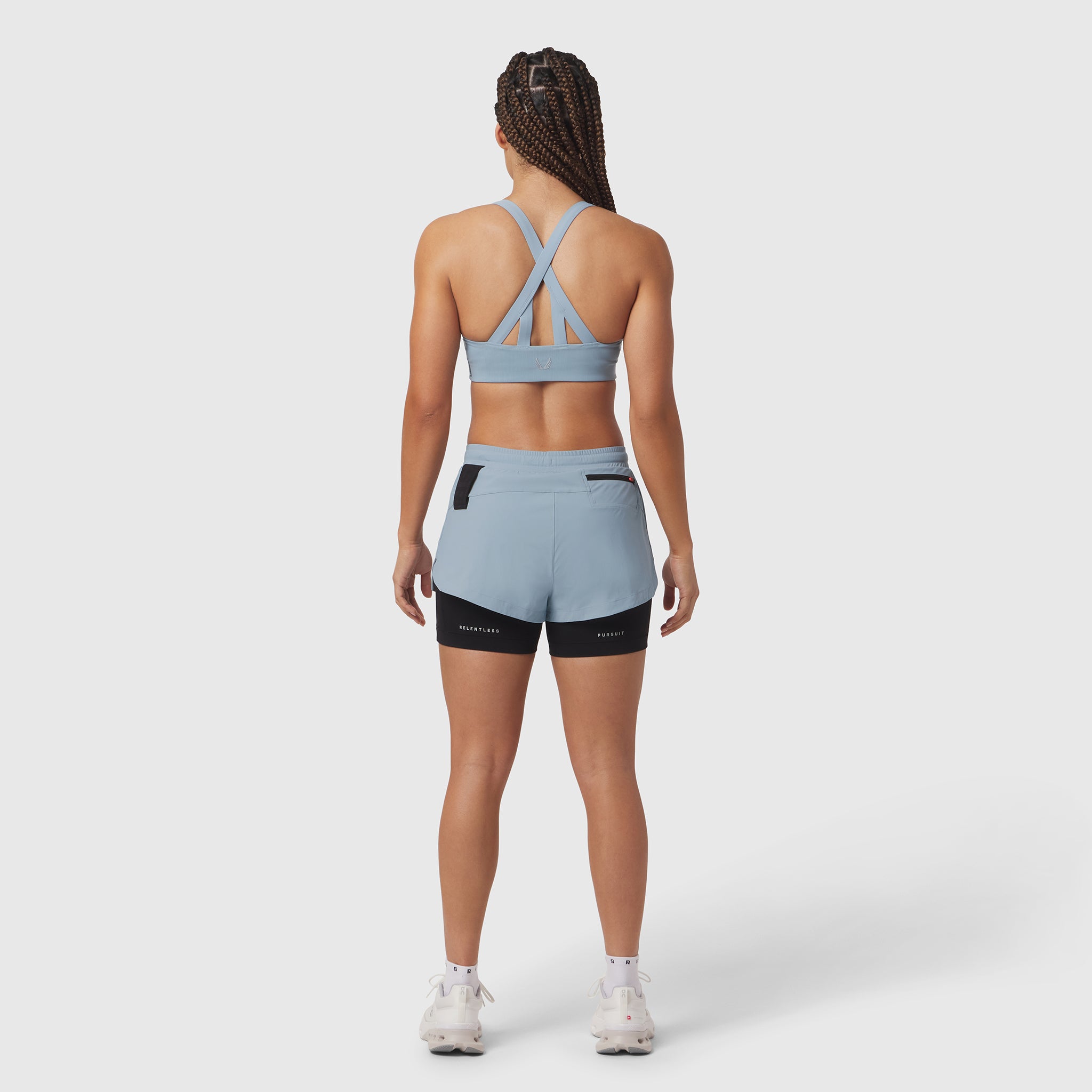 Tetra-Lite Liner Short in light sky, worn with matching sports bra, back view