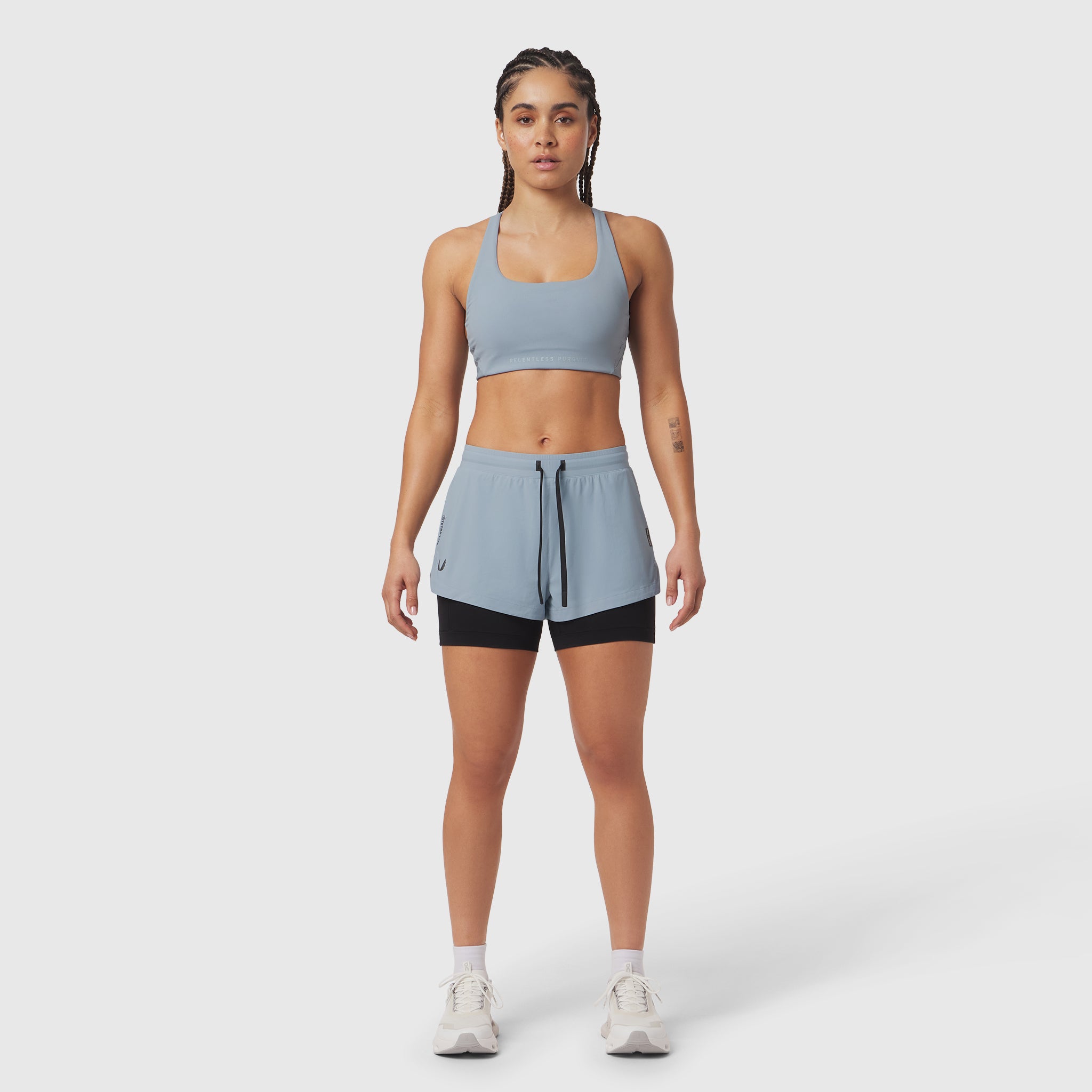 Tetra-Lite Liner Short in light sky and black, worn with matching sports bra, front view