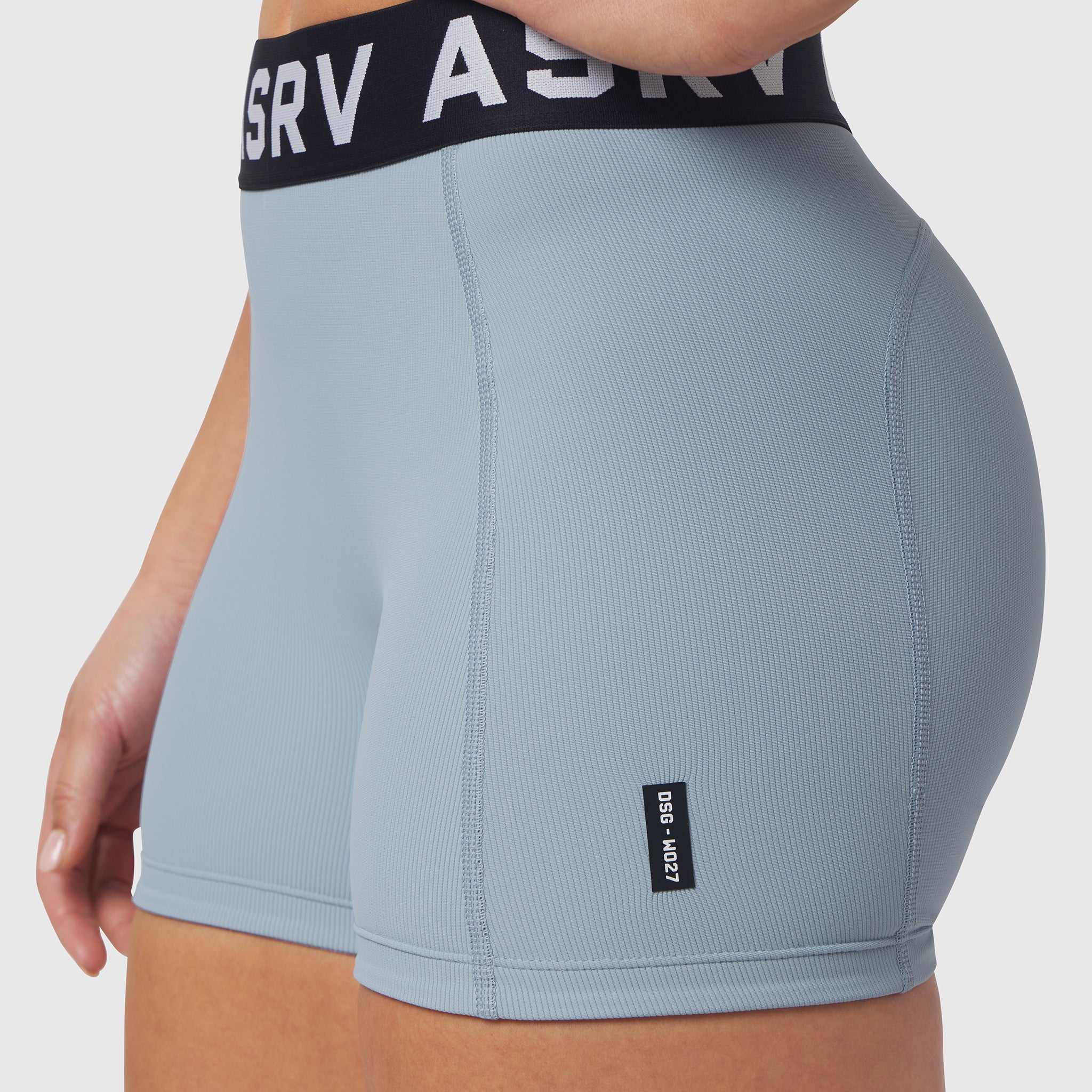 W027 Lycra Ribbed Short in light sky, worn on model, side view