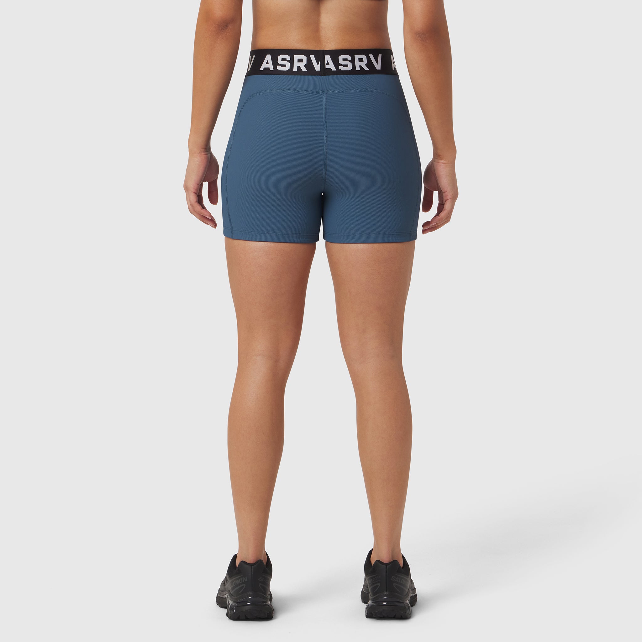 W027 Lycra Ribbed Short in storm blue, worn by model shown from behind