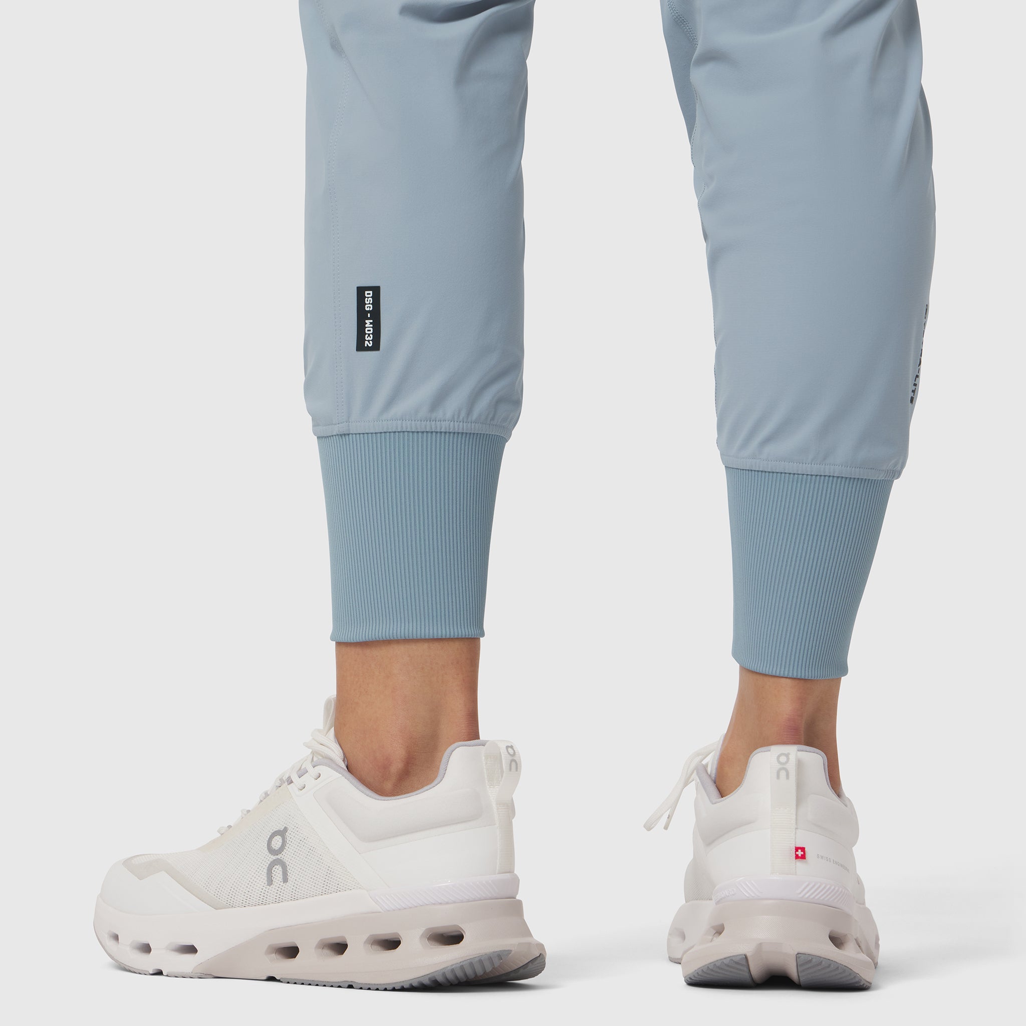 Tetra-Lite Cargo High Rib Jogger in Light Sky, worn with white sneakers, front view