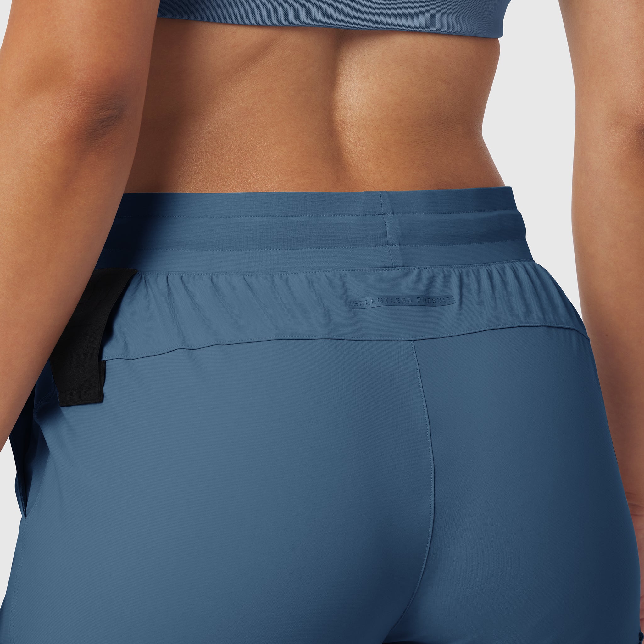 Tetra-Lite Cargo High Rib Jogger in Storm blue, back view on model