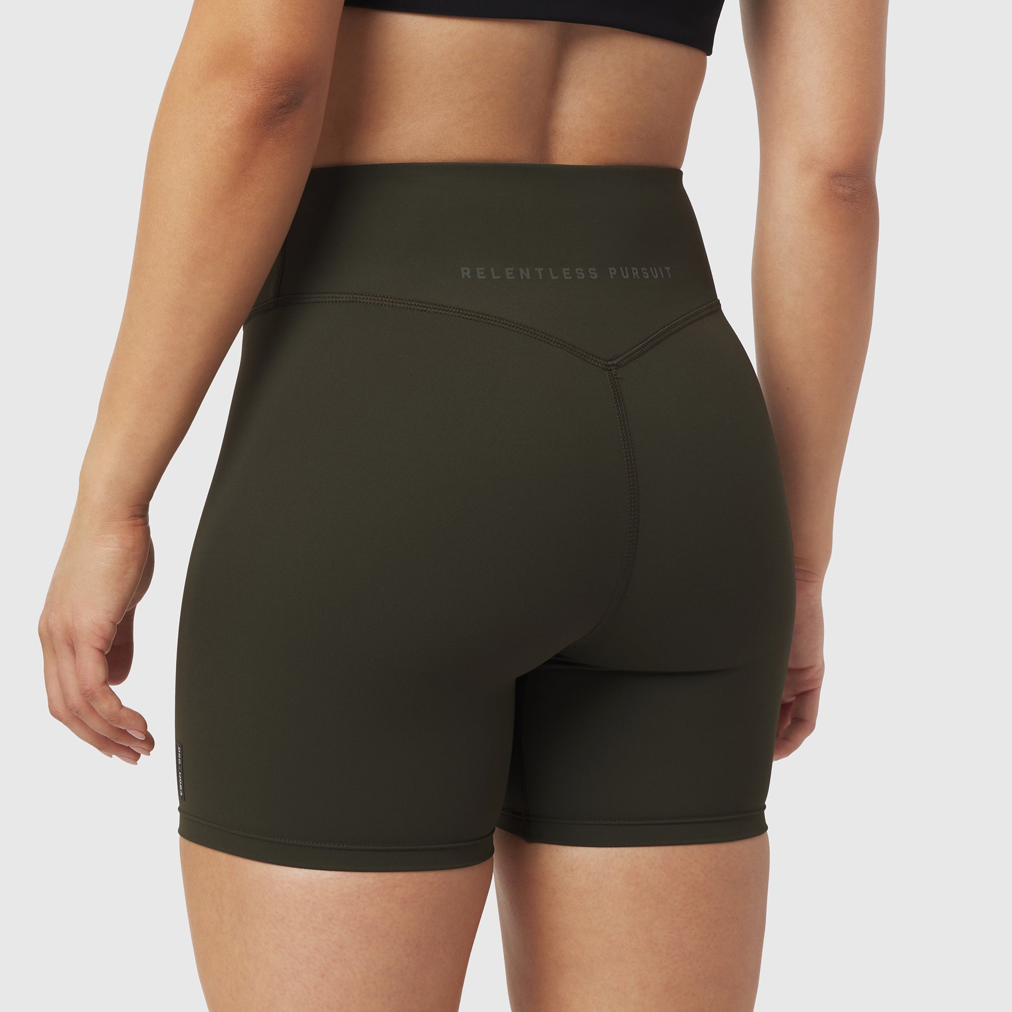 W064 LYCRA® ADAPTIV Biker Short in olive, worn by model, back view