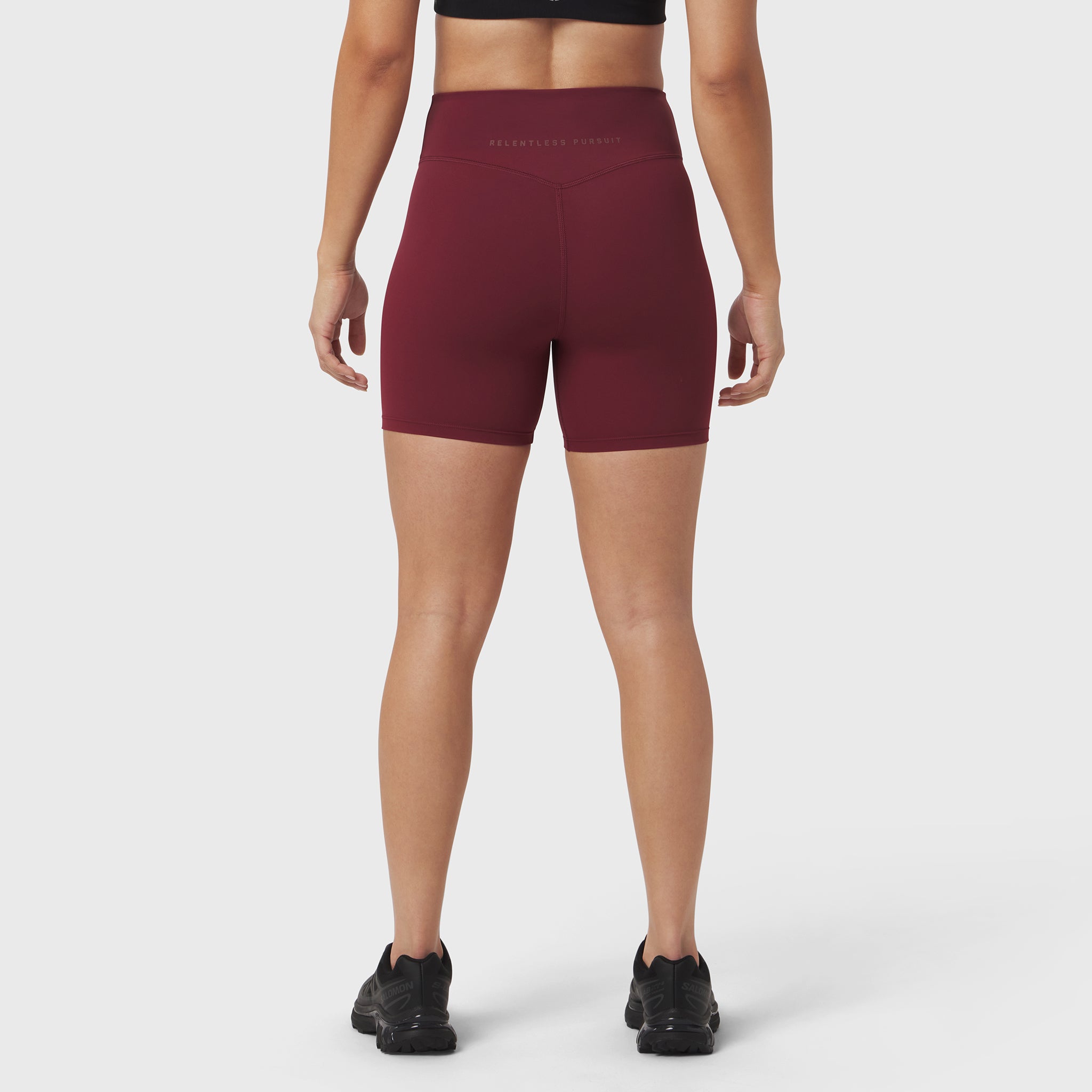 LYCRA® ADAPTIV Biker Short in crimson, rear view on model