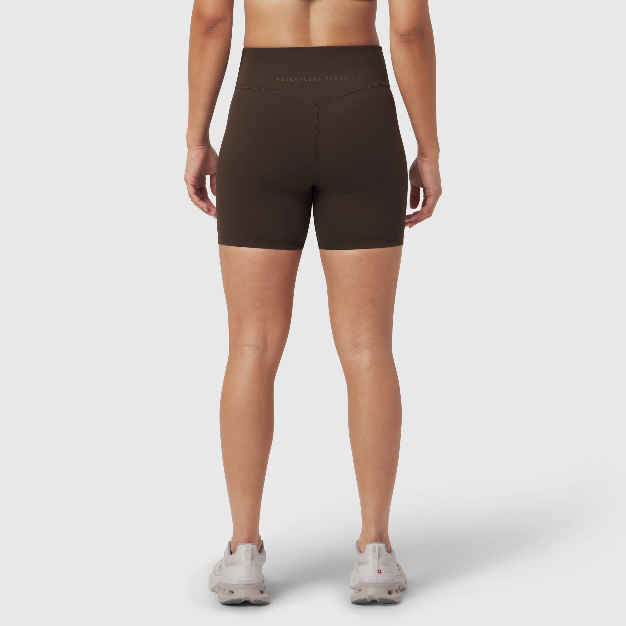 LYCRA® ADAPTIV Biker Short in Dark Earth, worn by model from behind