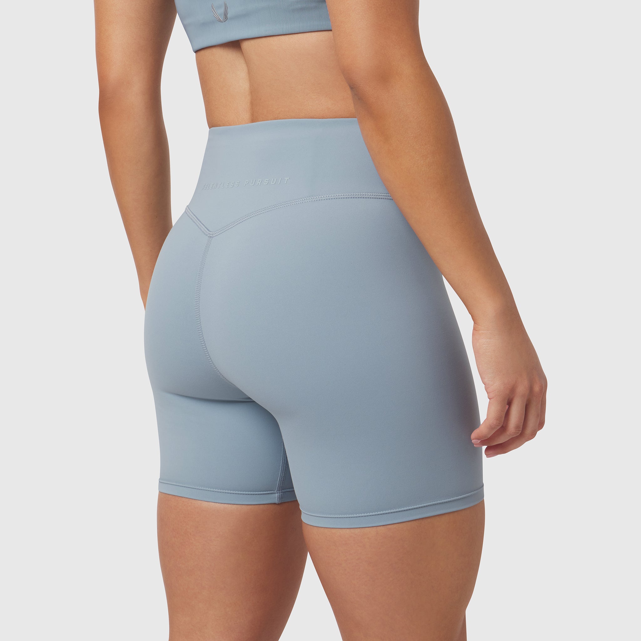 LYCRA® ADAPTIV Biker Short in Light Sky, rear view on model